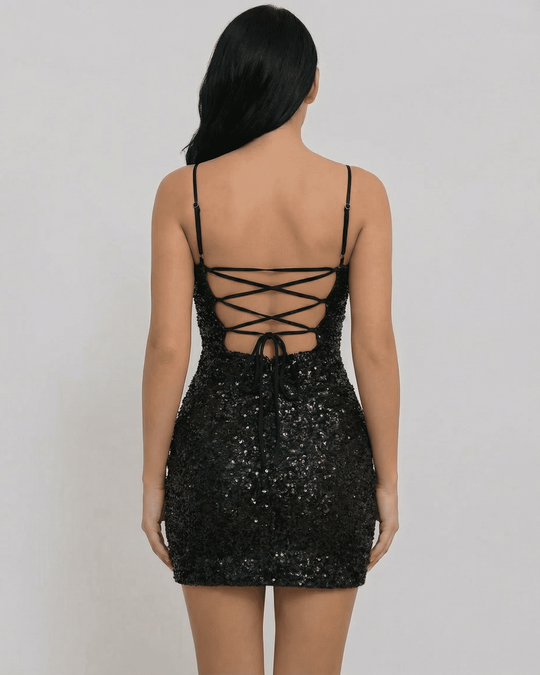 Back view of Lauven Orion Mini Dress showcasing black sequins and lace-up design.