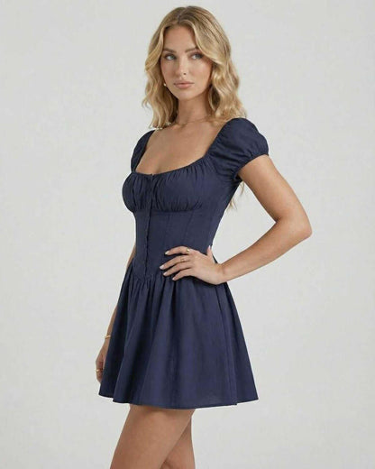 Orion Mini Dress by Lauven in deep navy with puff sleeves, showcasing elegant fit and flare silhouette.