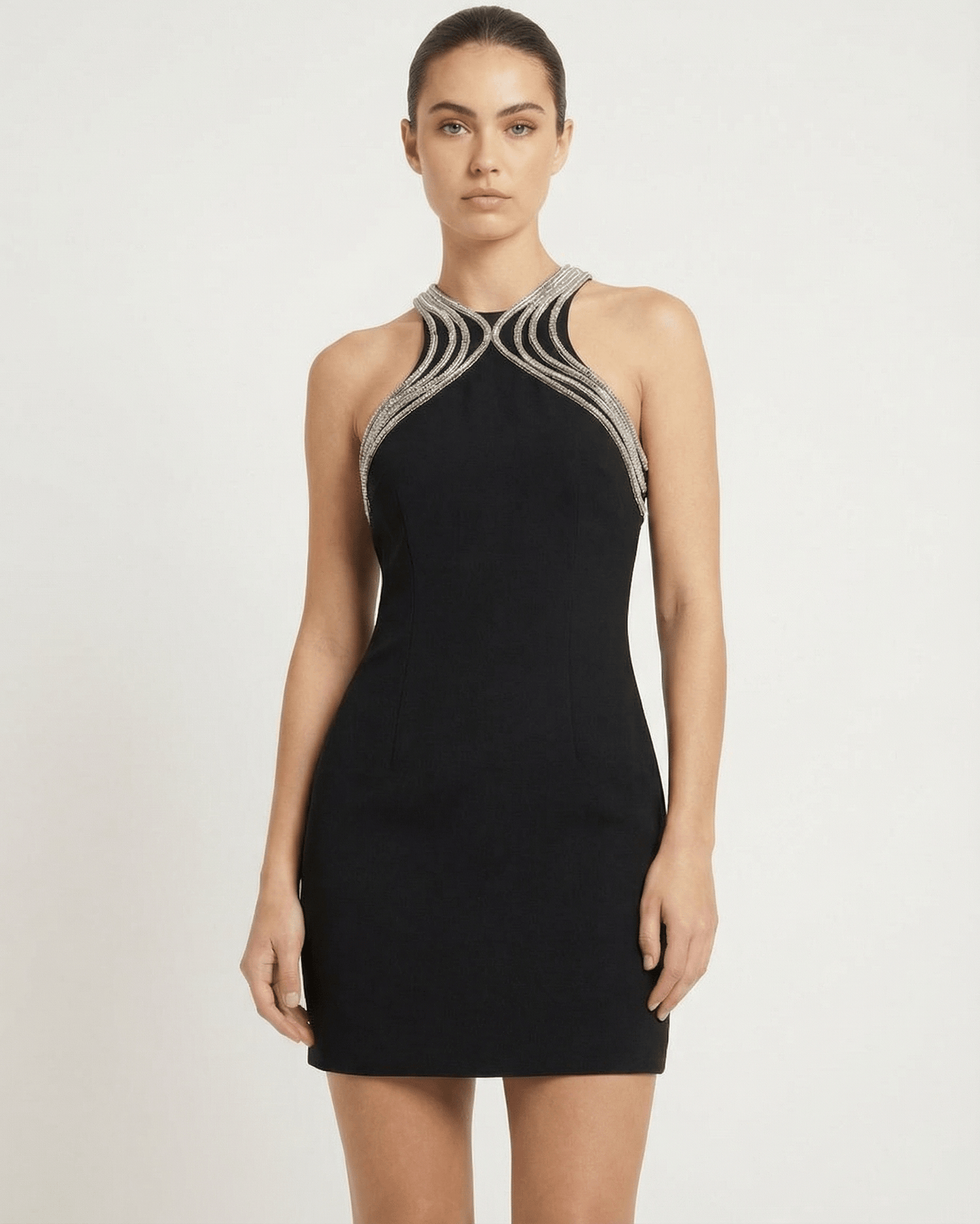 Orion Mini Dress by Lauven, sleeveless sheath mini dress with embellished O-neck and metallic trim.
