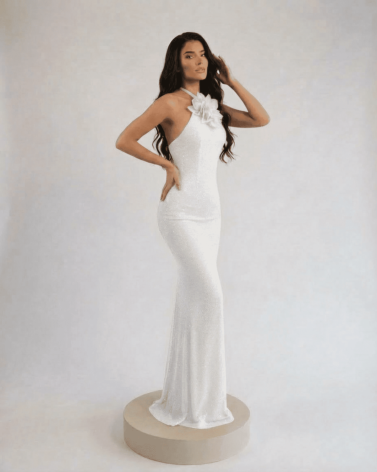 Lauven Pearl Maxi Dress featuring a halter neck and floral accent in elegant white sparkle.