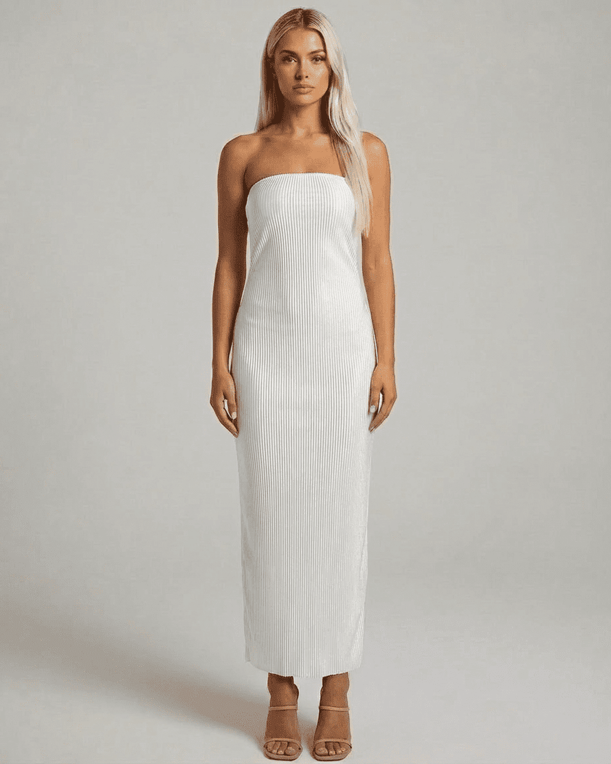 Lauven Pearl Maxi Dress featuring a strapless tube silhouette and subtle ruched texture for a modern, elegant look.