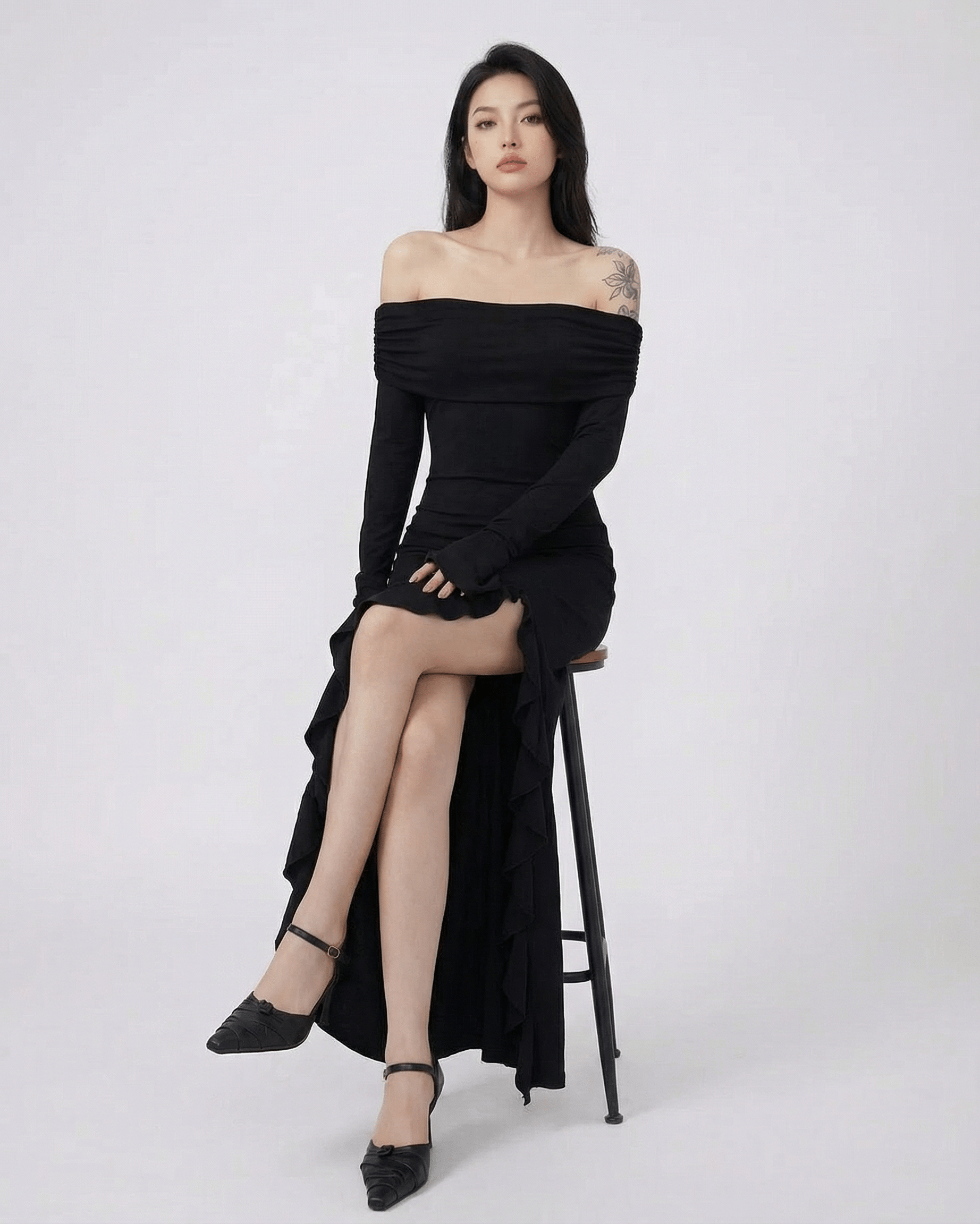 Raven Maxi Dress by Lauven — Black off-shoulder dress with asymmetrical ruffles and flare sleeves.