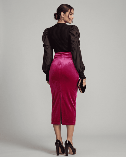 Elegant woman in Rosalia Midi Skirt by Lauven, showcasing velvet texture and back slit details.