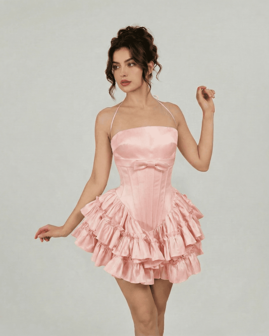 Rosé Mini Dress by Lauven featuring a corset-inspired bodice and tiered ruffles in soft blush pink.