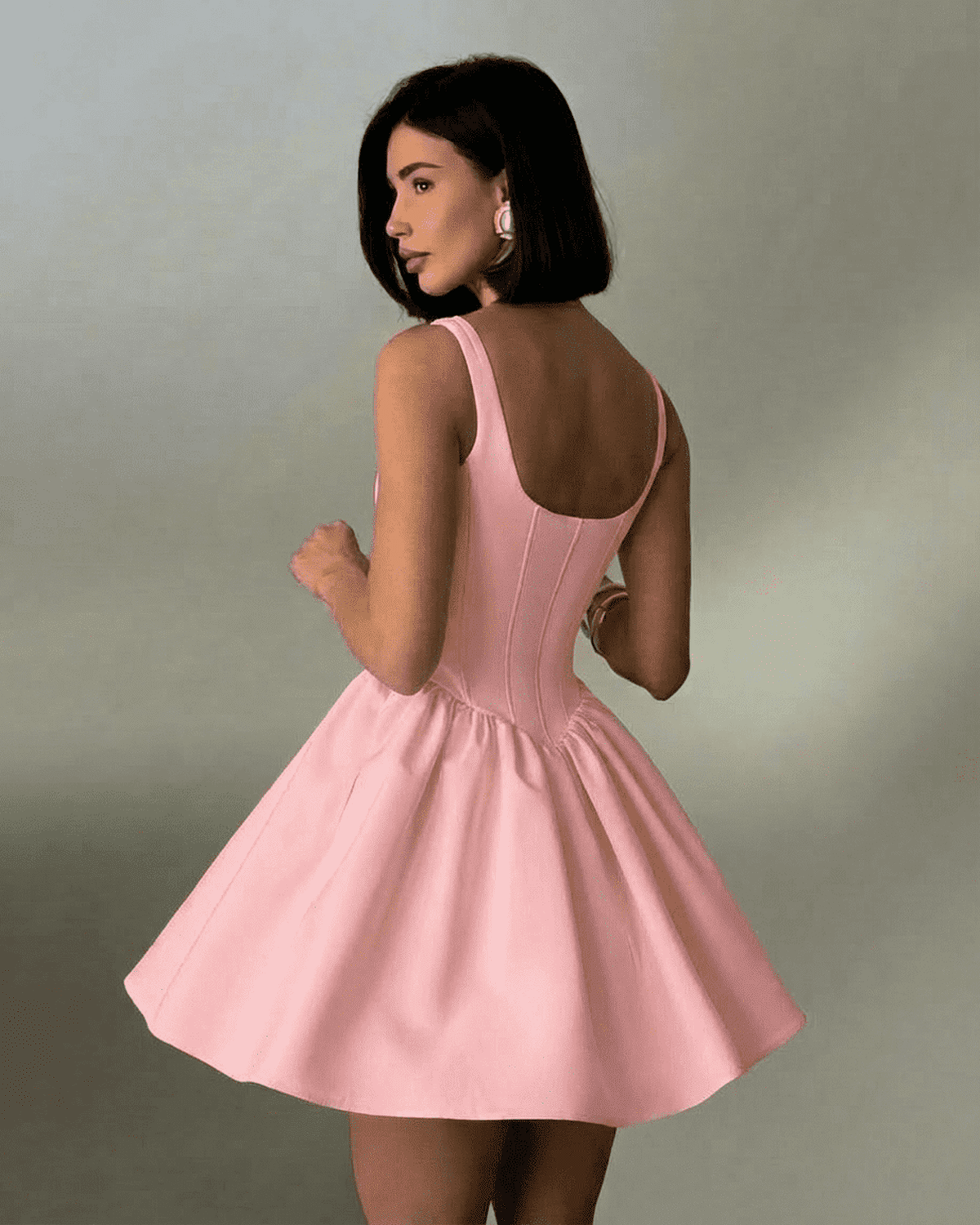 Lauven Rosé Mini Dress in soft pink with structured corset design and square neckline, showcasing a flattering silhouette.