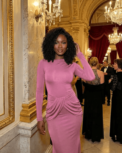 Elegant model in Rosea Maxi Dress by Lauven, showcasing long sleeves and ruched waist detail in soft pink.