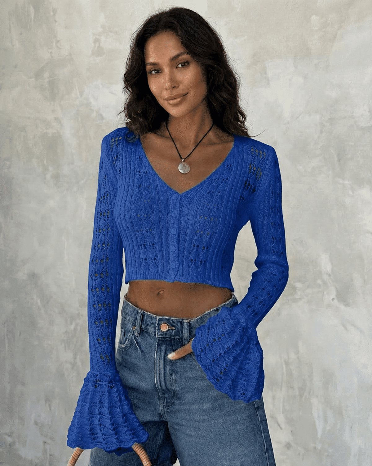 Royal Cardigan by Lauven, cropped cotton knit with flare sleeves, showcasing vibrant blue color and intricate hollow-out detailing.