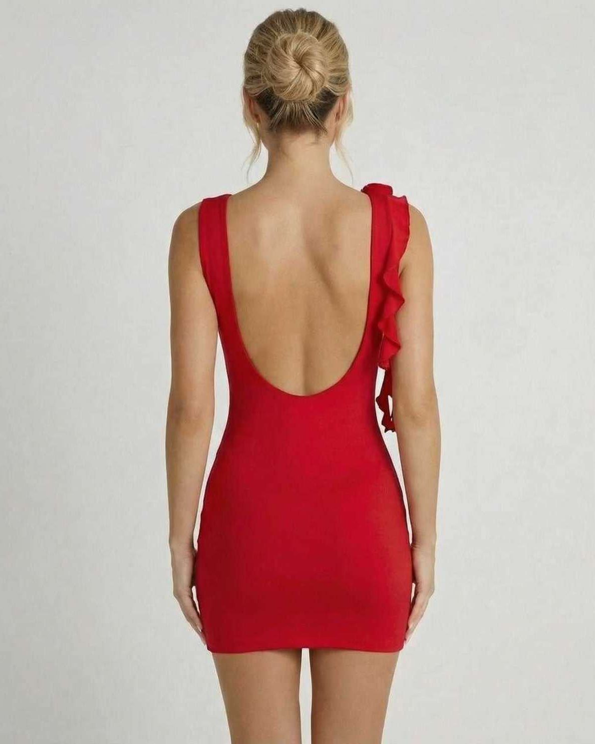 Back view of Lauven Ruby Mini Dress, a bold red sleeveless bodycon dress with ruffle detail.