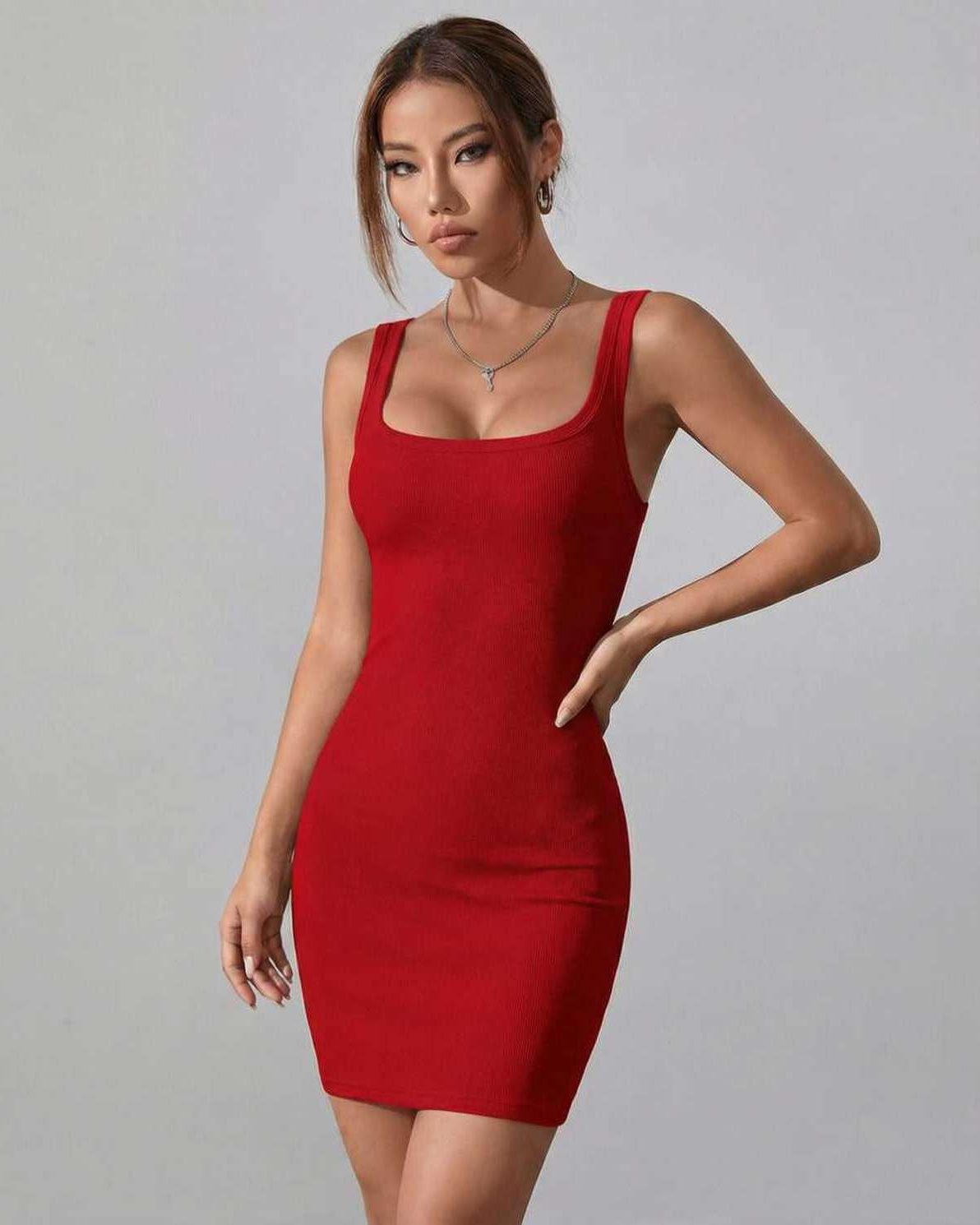 Ruby Mini Dress by Lauven in classic red ribbed knit, showcasing a bodycon silhouette and square neckline.