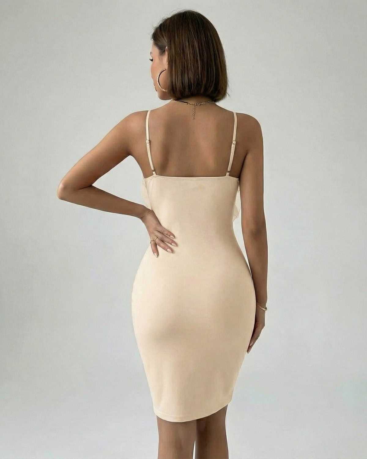 Sable Mini Dress by Lauven in chic nude polyester, showcasing a sleek back view and adjustable spaghetti straps.