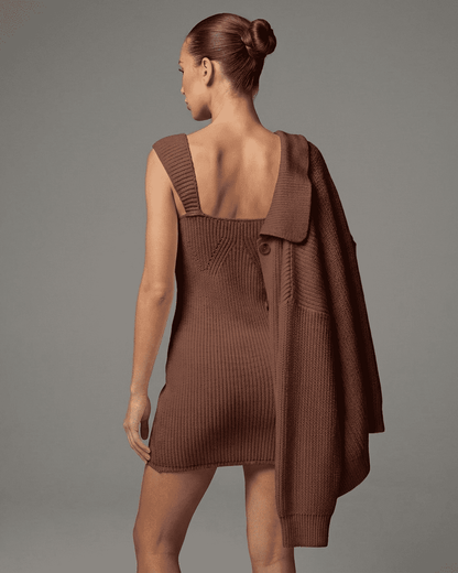 Model wearing Sable Mini Dress by Lauven, showcasing its elegant knit design and rich brown tone.