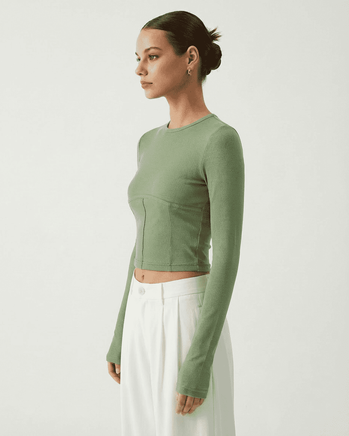 Sage Corset Top by Lauven, long sleeve jersey crop with structured corset design and soft green fabric.