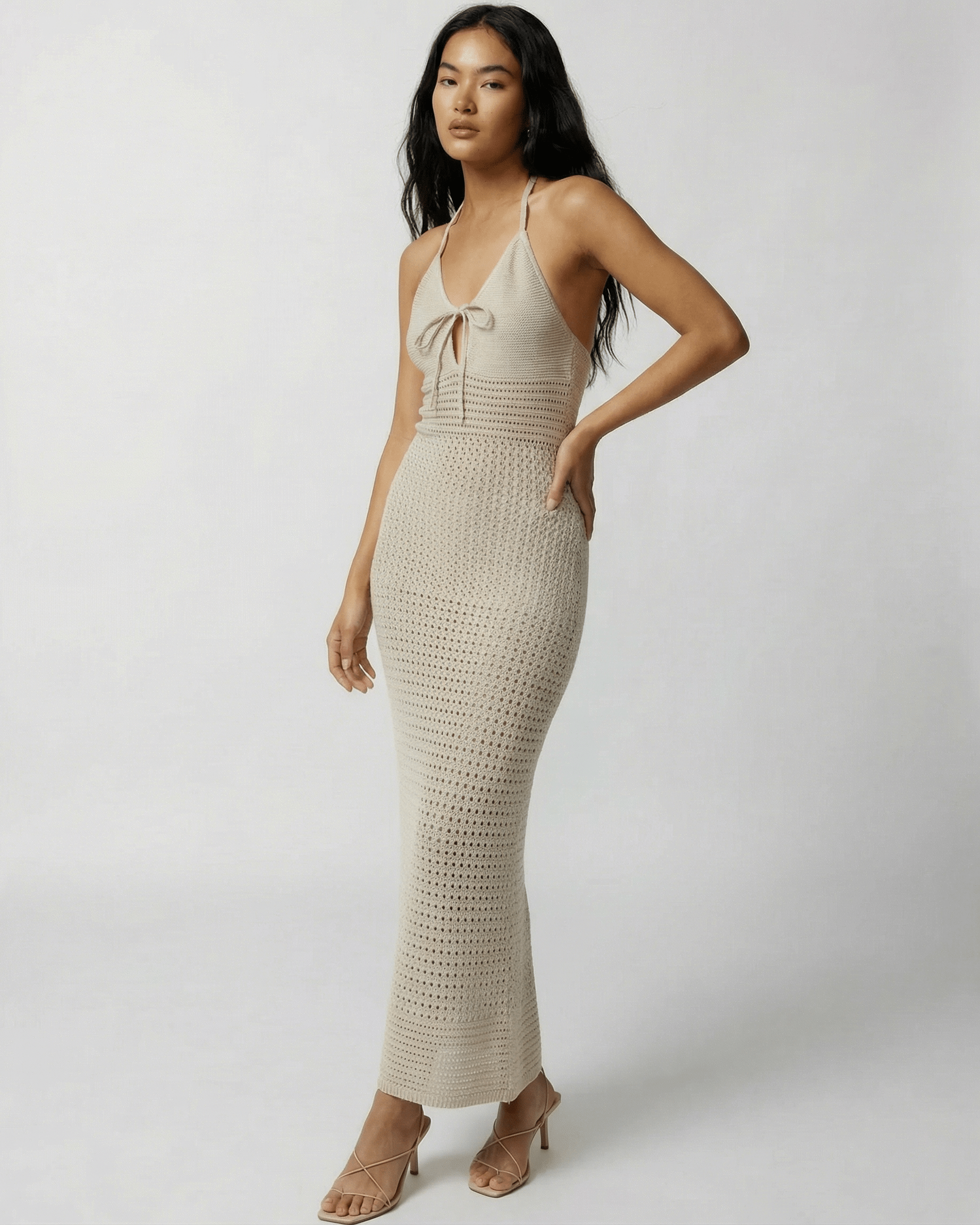 Sahara Maxi Dress by Lauven featuring a crochet halter neck, open-knit detailing, and a soft neutral tone.