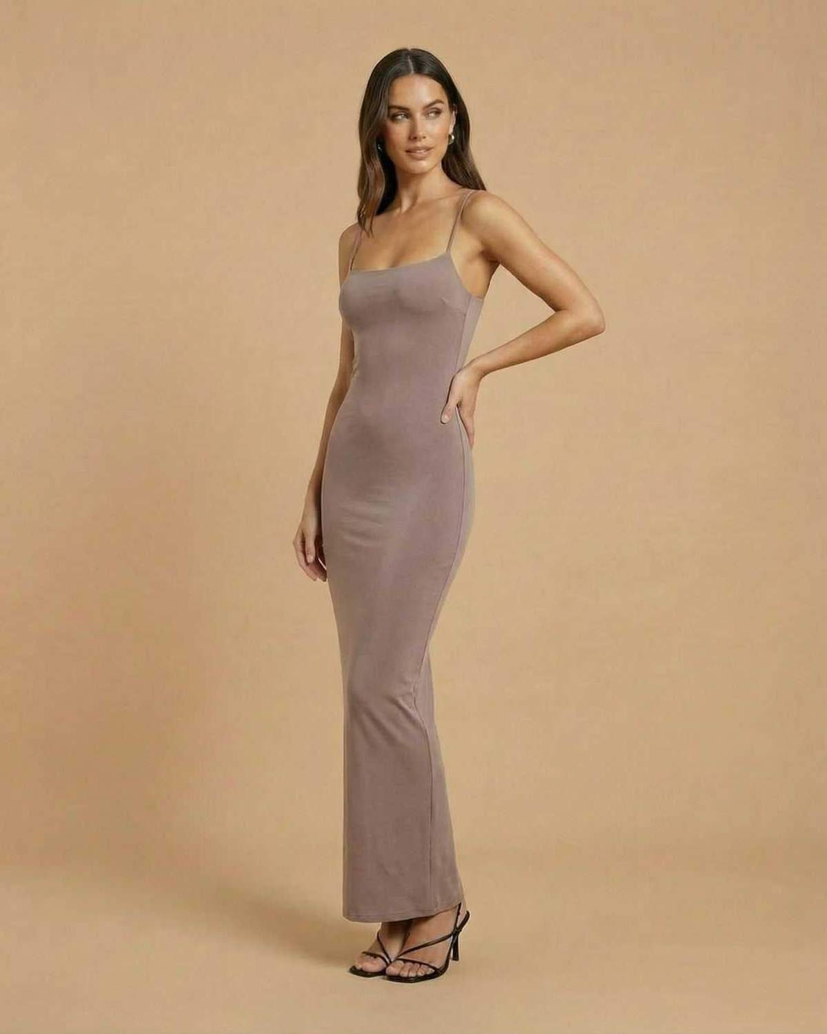 Sahara Maxi Dress by Lauven in taupe with spaghetti straps and minimal backless design, showcasing modern elegance.