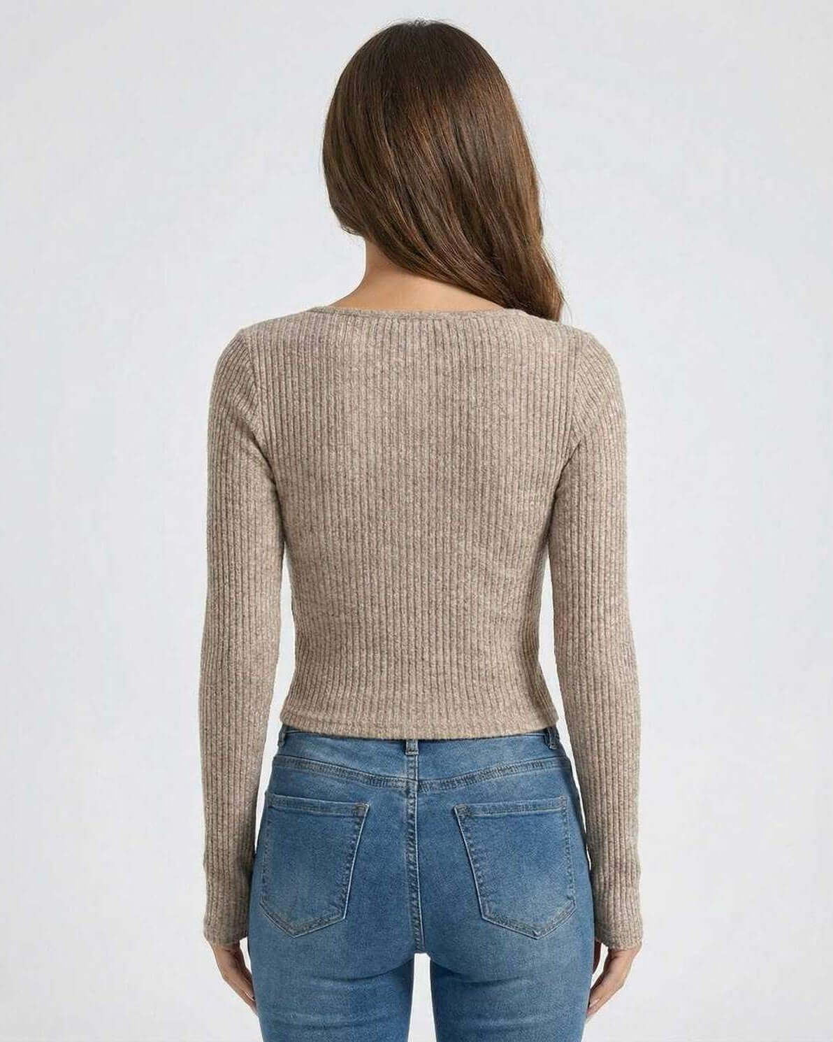 Back view of Sahara Pullover by Lauven, showcasing women's ribbed U-neck long sleeve sweater in soft neutral tone.