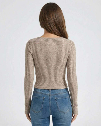 Back view of Sahara Pullover by Lauven, showcasing women's ribbed U-neck long sleeve sweater in soft neutral tone.