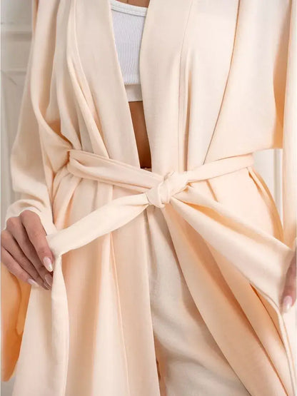 Sahara Suit Set by Lauven, showcasing a luxurious beige oversized two-piece with a tied waist detail.