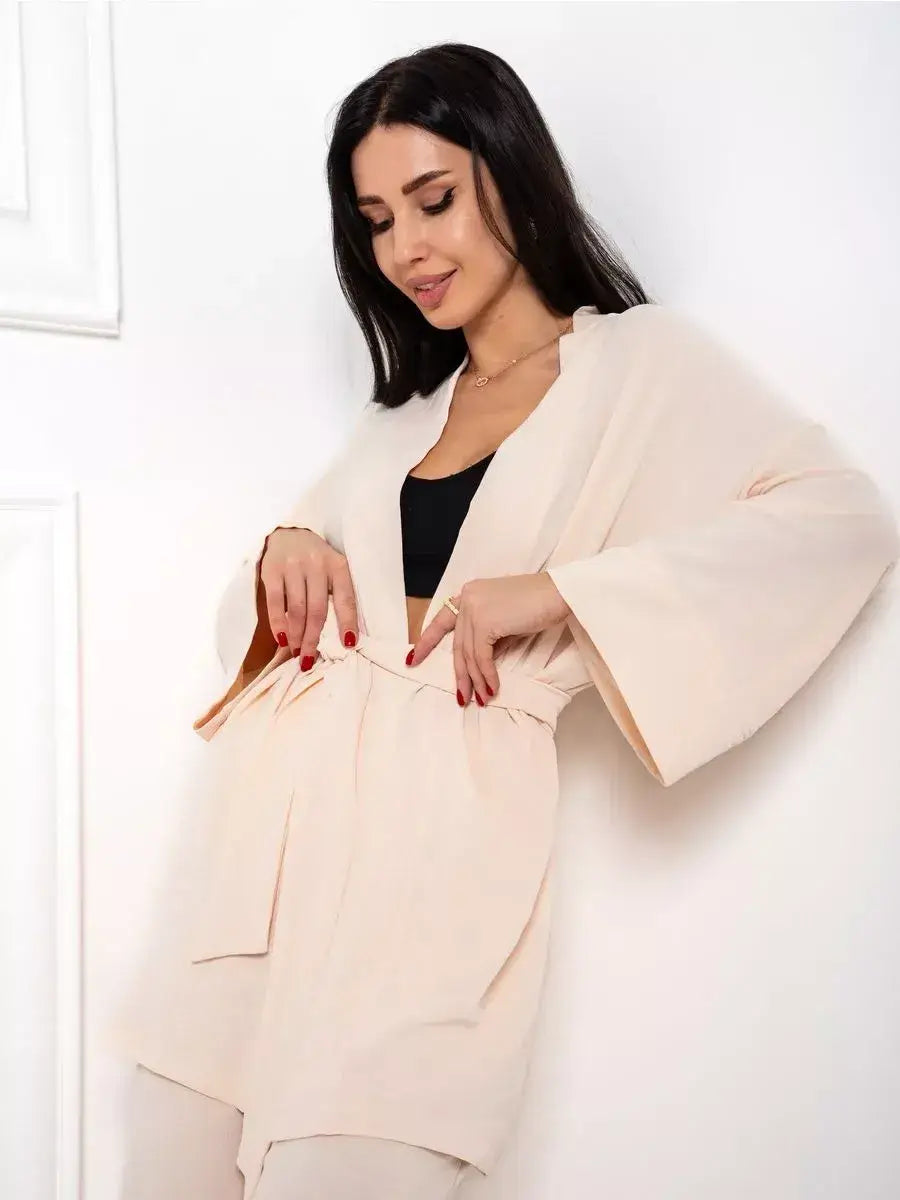 Model showcasing the Sahara Suit Set from Lauven, featuring a luxurious beige oversized design.