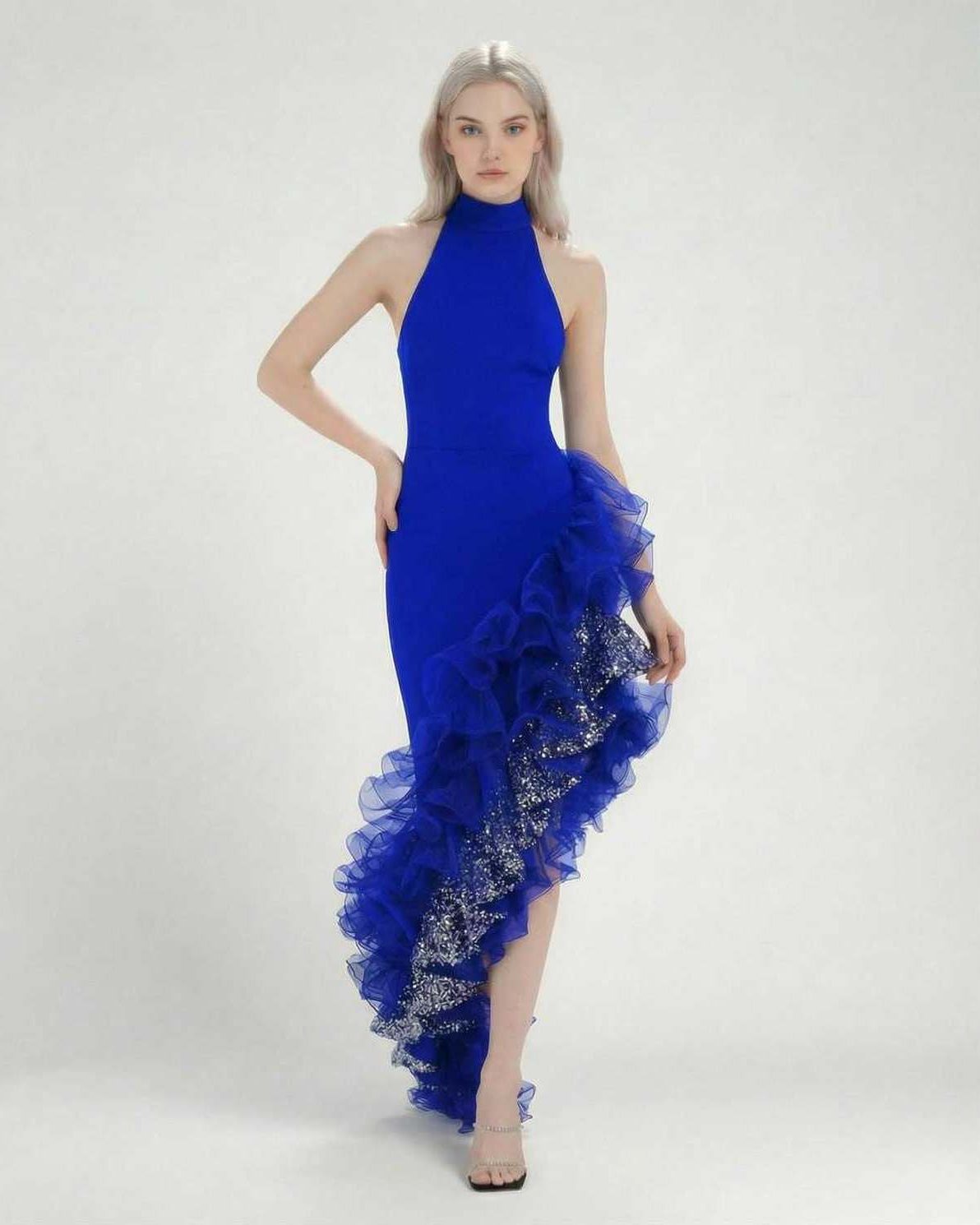 Sapphire Maxi Dress by Lauven, featuring a blue halter neck and asymmetrical ruffle detail.