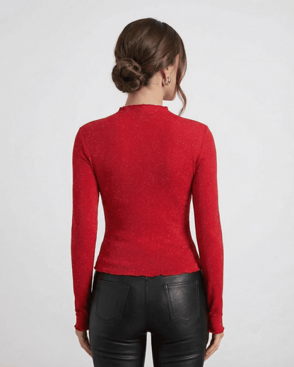 Back view of a woman wearing a Scarlet Blouse by Lauven, showcasing the long sleeve design and fitted silhouette.