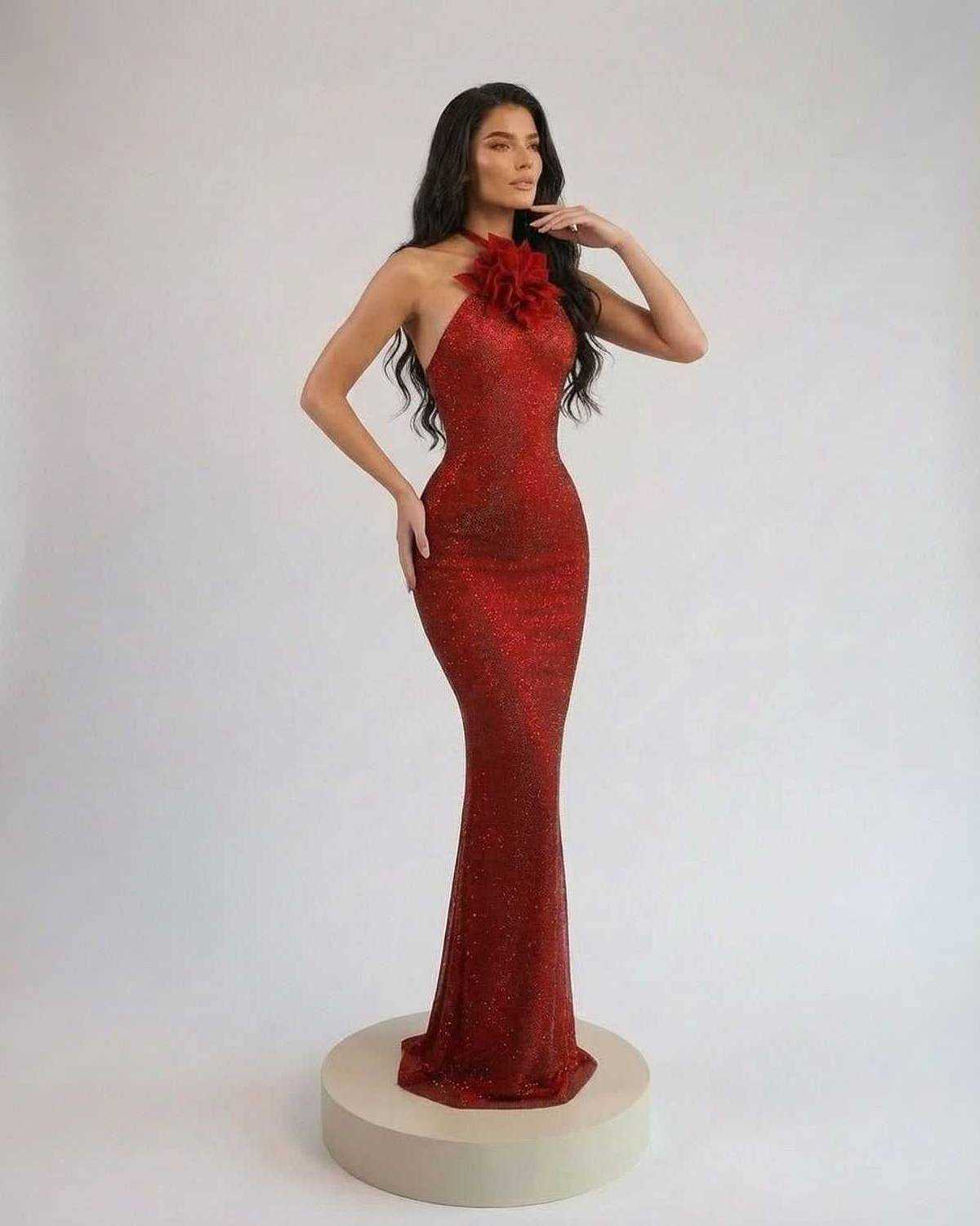 Scarlet Maxi Dress by Lauven featuring a halter neck and floral detail, elegantly highlighting its fitted silhouette.