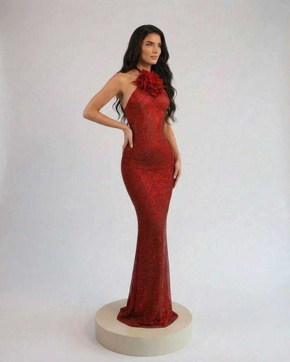 Scarlet Maxi Dress by Lauven featuring a sleek halter neck and floral detail in rich red shimmer fabric.