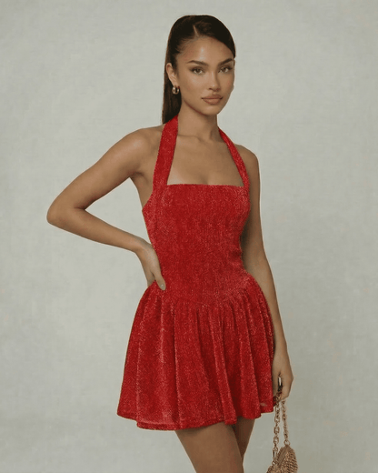Scarlet Mini Dress by Lauven, a sleeveless red sequin A-line mini with halter neckline and high waist silhouette.