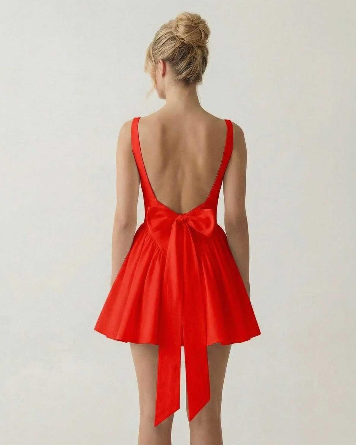 Scarlet Mini Dress by Lauven - Back view of a red mini dress with square neckline and bow detail.