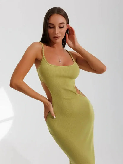 Model wearing a Lauven Sculpt Cutout Midi Dress in pistachio with side cut-outs showcasing a modern silhouette.