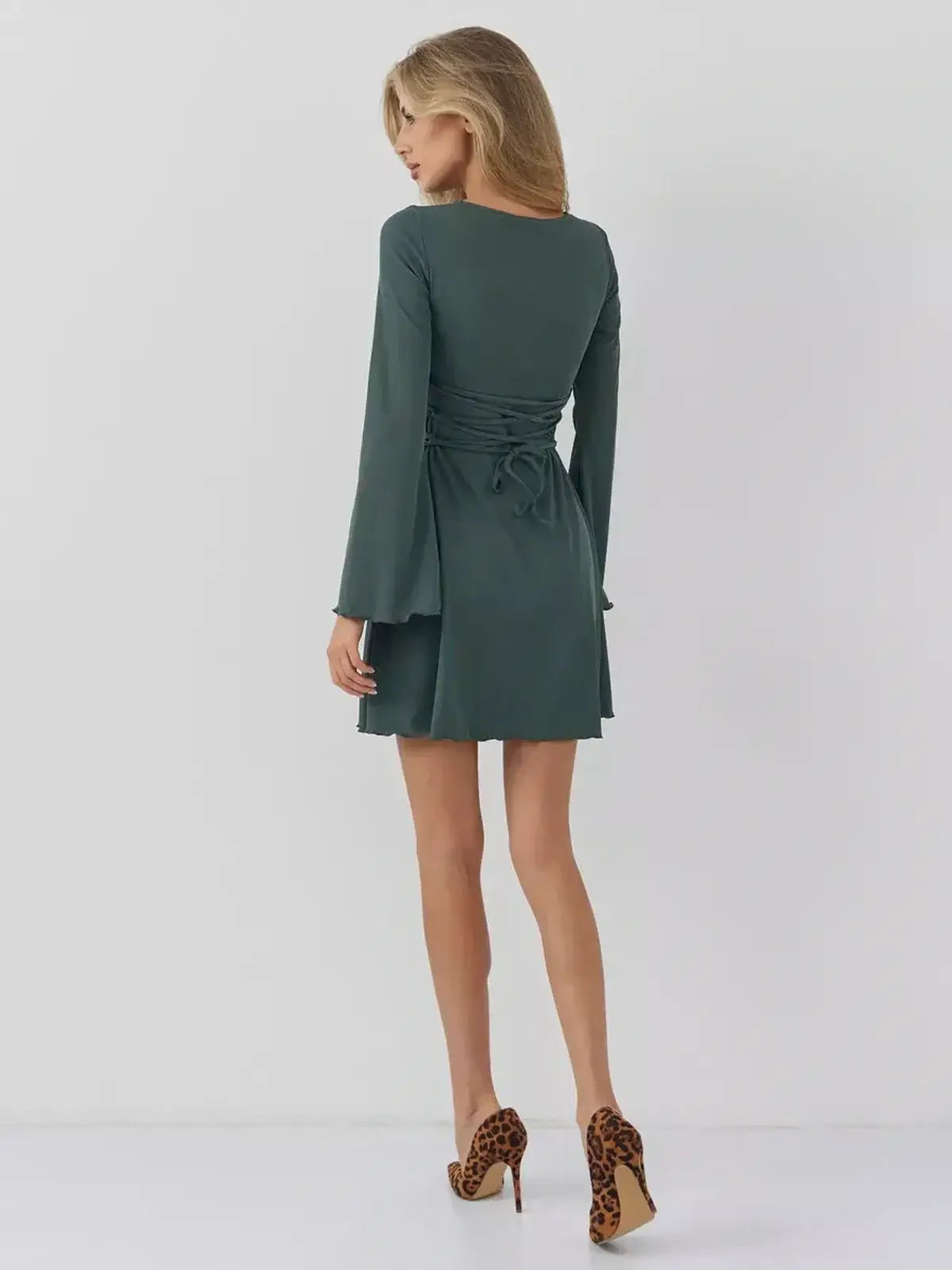 Back view of Sculpt Flare mini dress by Lauven, featuring lace-up ties and bell sleeves in dark olive color.