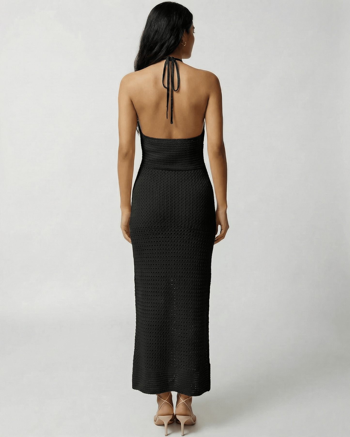 Selene Maxi Dress by Lauven, showcasing an open-back crochet halter silhouette in black.