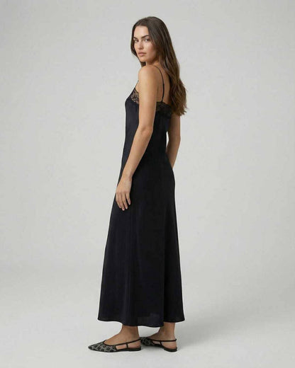 Selene Maxi Dress by Lauven, featuring a sleek, lace-trimmed design and minimalist spaghetti straps.
