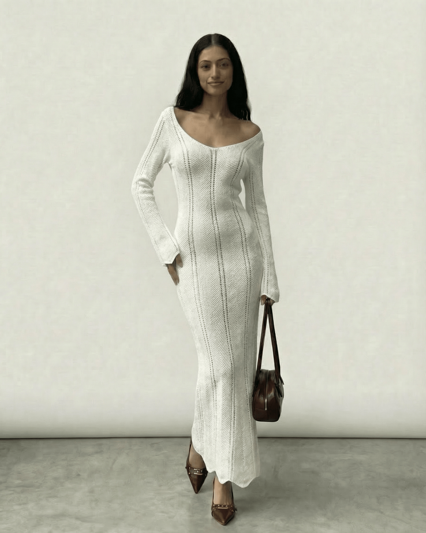Selene Maxi Dress by Lauven, featuring a ribbed bodycon design in ivory with a V-neck and long flare sleeves.