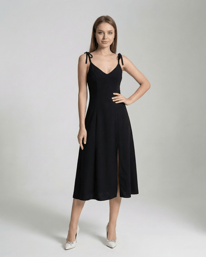 Selene Midi Dress by Lauven - Elegant black midi dress with tie straps and a graceful silhouette.