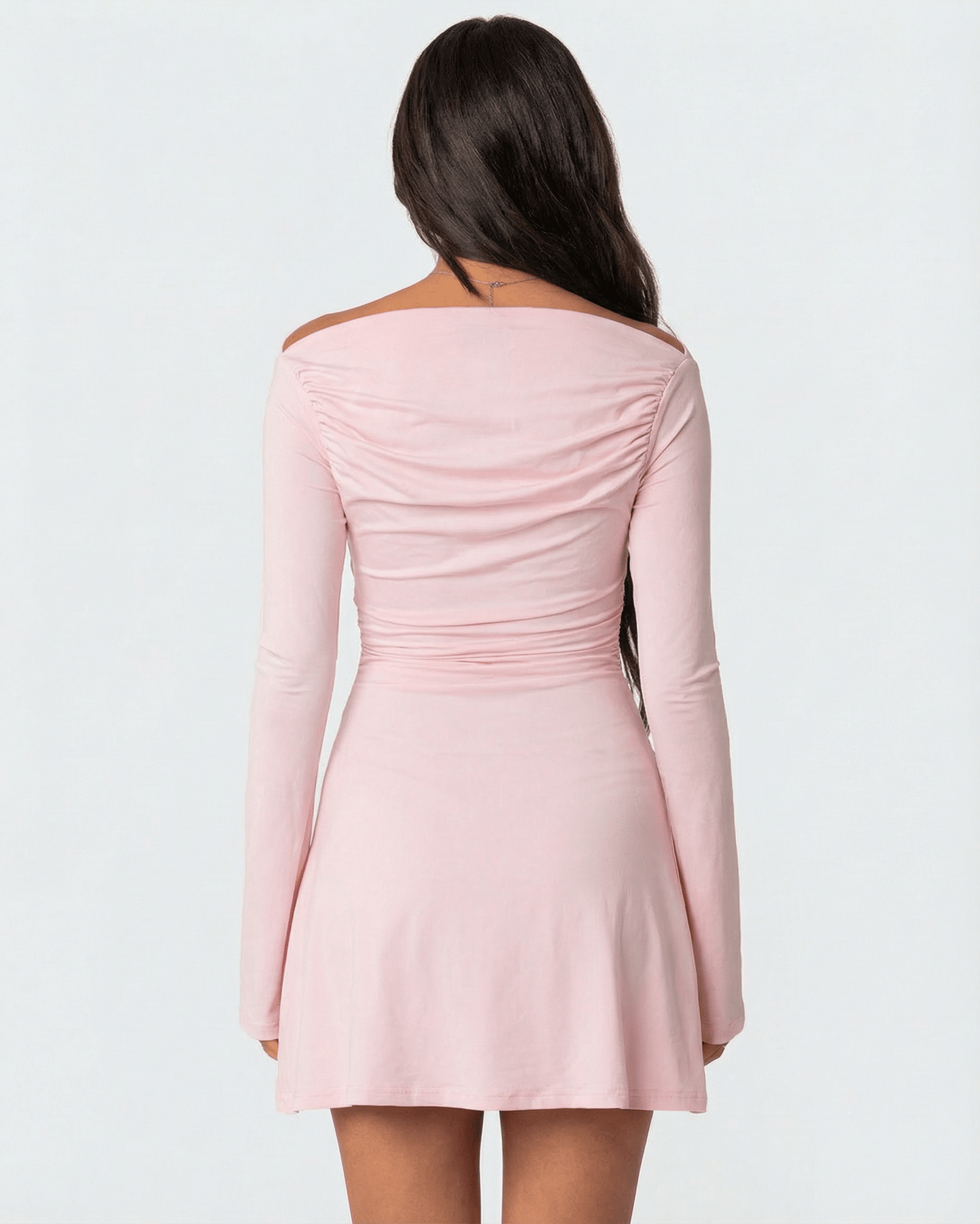 Selene Mini Dress by Lauven - Back view showcasing asymmetrical neckline and slim silhouette in soft pink.