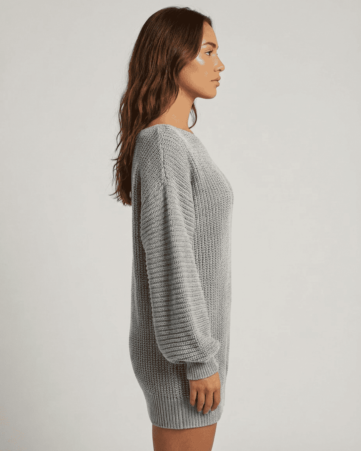 Selene Mini Dress by Lauven in grey ribbed knit with off-the-shoulder lantern sleeves styled in a side profile view.