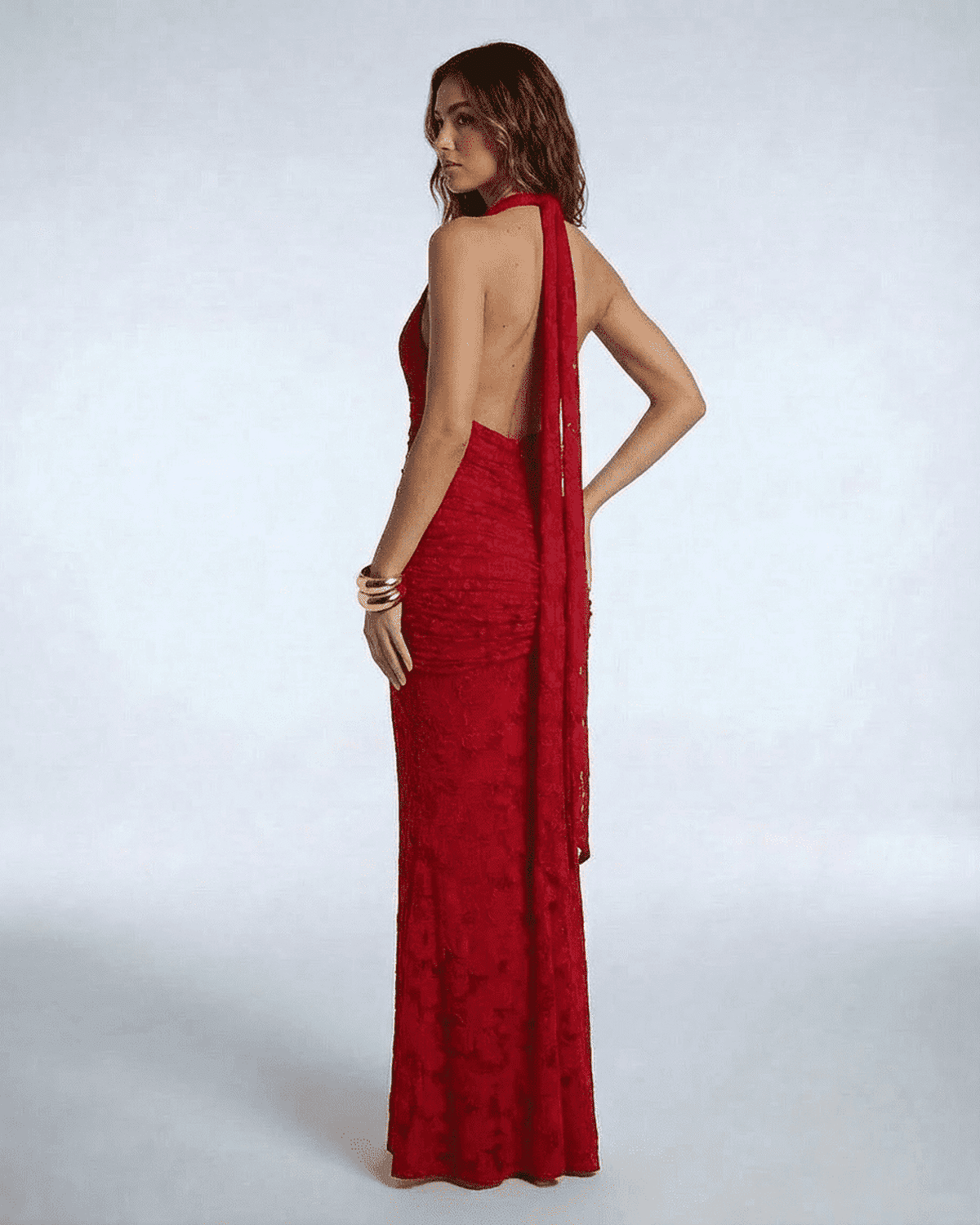 Seraphina Maxi Dress by Lauven - Back view of the red jacquard mermaid gown with ribbon tie and deep V-neckline.