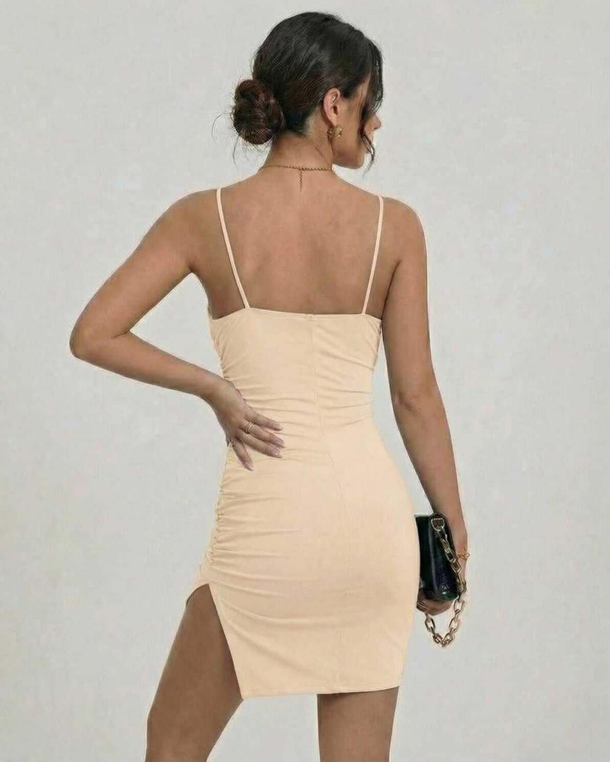 Serena Mini Dress by Lauven featuring a soft cream color, bodycon fit, and stylish side split for a modern silhouette.