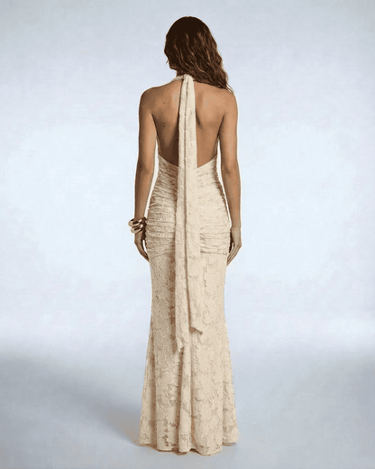 Back view of Serenella Maxi Dress by Lauven showcasing elegant ruched design and stunning tie ribbon.