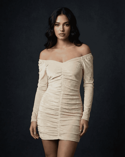 Siena Mini Dress by Lauven in ruched velvet with off-the-shoulder neckline and long sleeves.