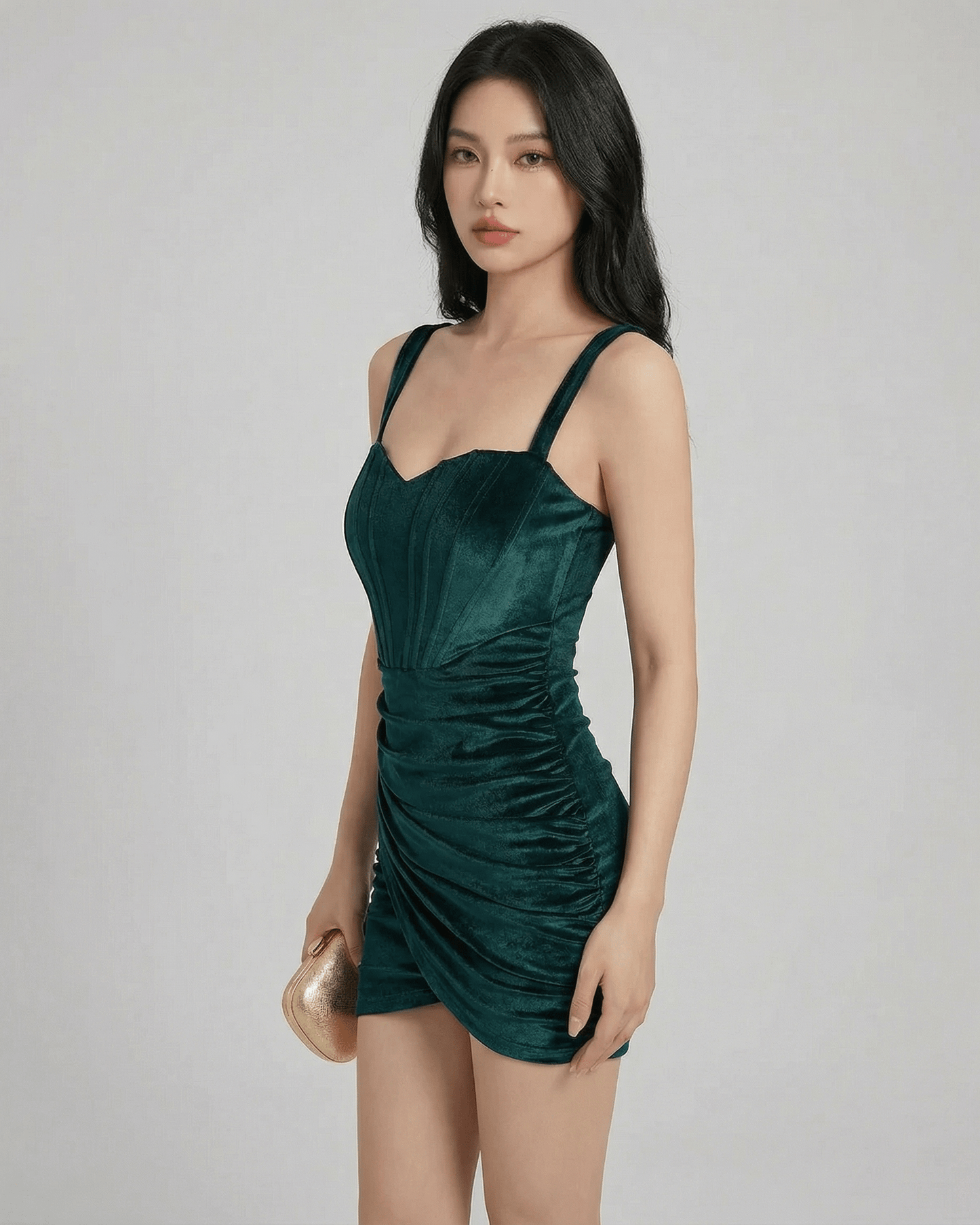Siena Mini Dress by Lauven – Emerald green velvet bodycon mini dress with structured detailing and spaghetti straps.
