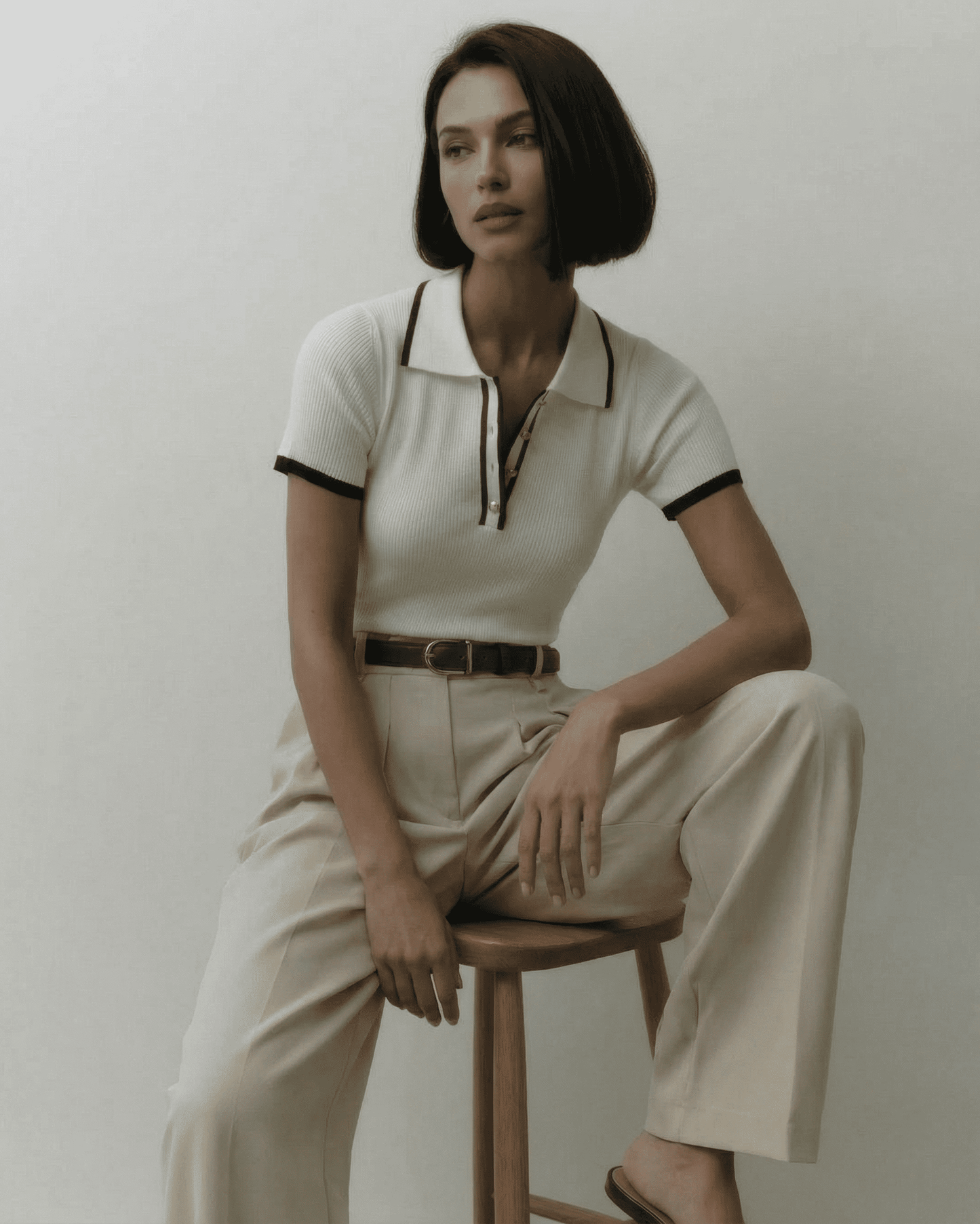 Siena Polo Shirt by Lauven, showcased by a model in a polished, refined style with modern contrast details.