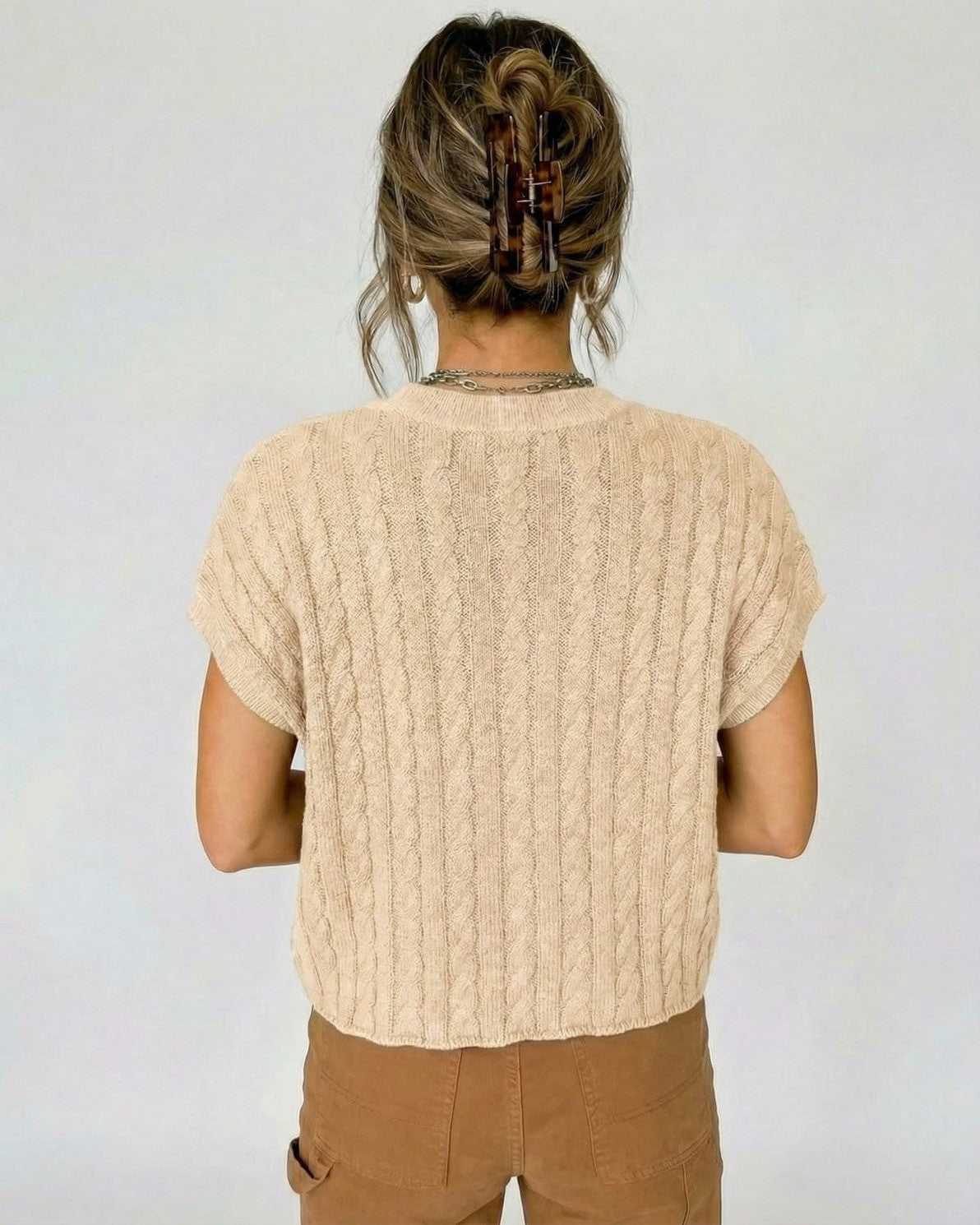 Siena Sweater by Lauven, back view of beige cable knit short sleeve women’s sweater for modern casual wear.