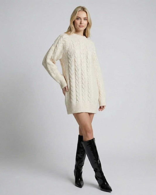 Lauven Sienna Mini Dress in cream cable knit, showcasing a refined silhouette and paired with stylish knee-high boots.