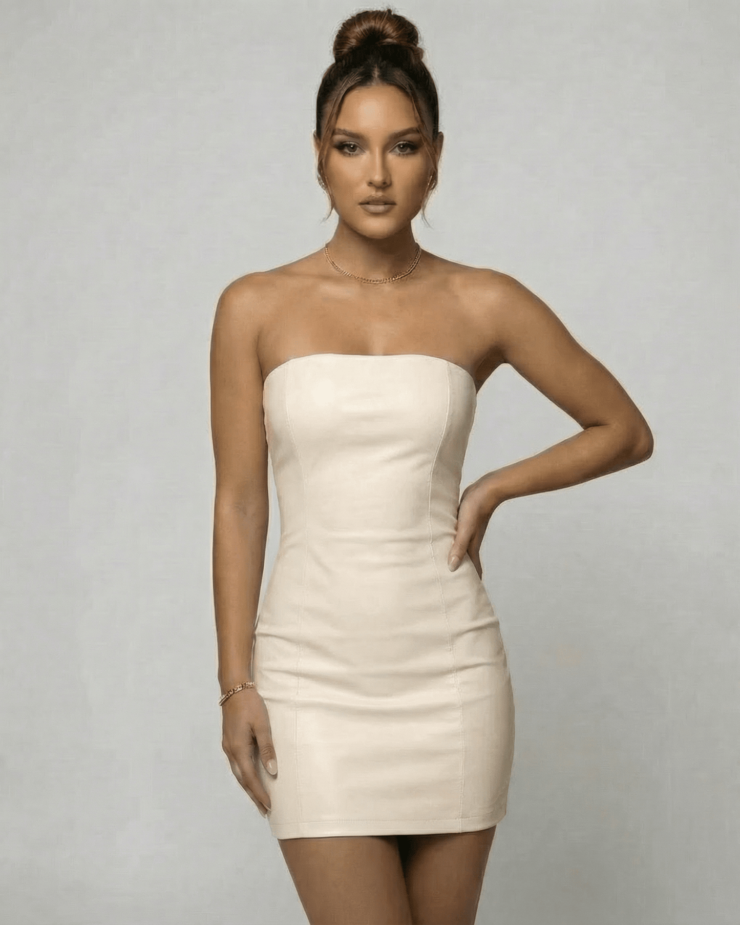 Sienna Mini Dress by Lauven in strapless beige PU, showcasing a refined pencil silhouette for summer and evening wear.