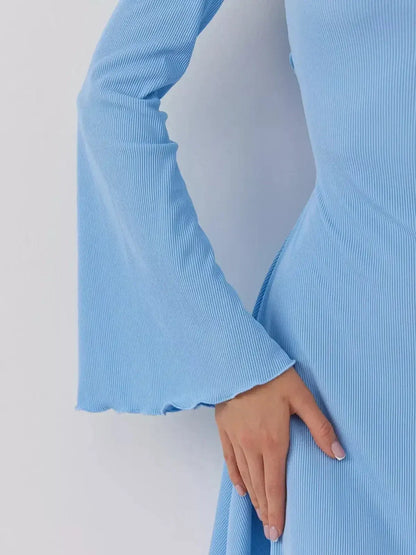 Close-up detail of the Skyline Cutout mini dress by Lauven in dreamy sky blue with flared sleeves.