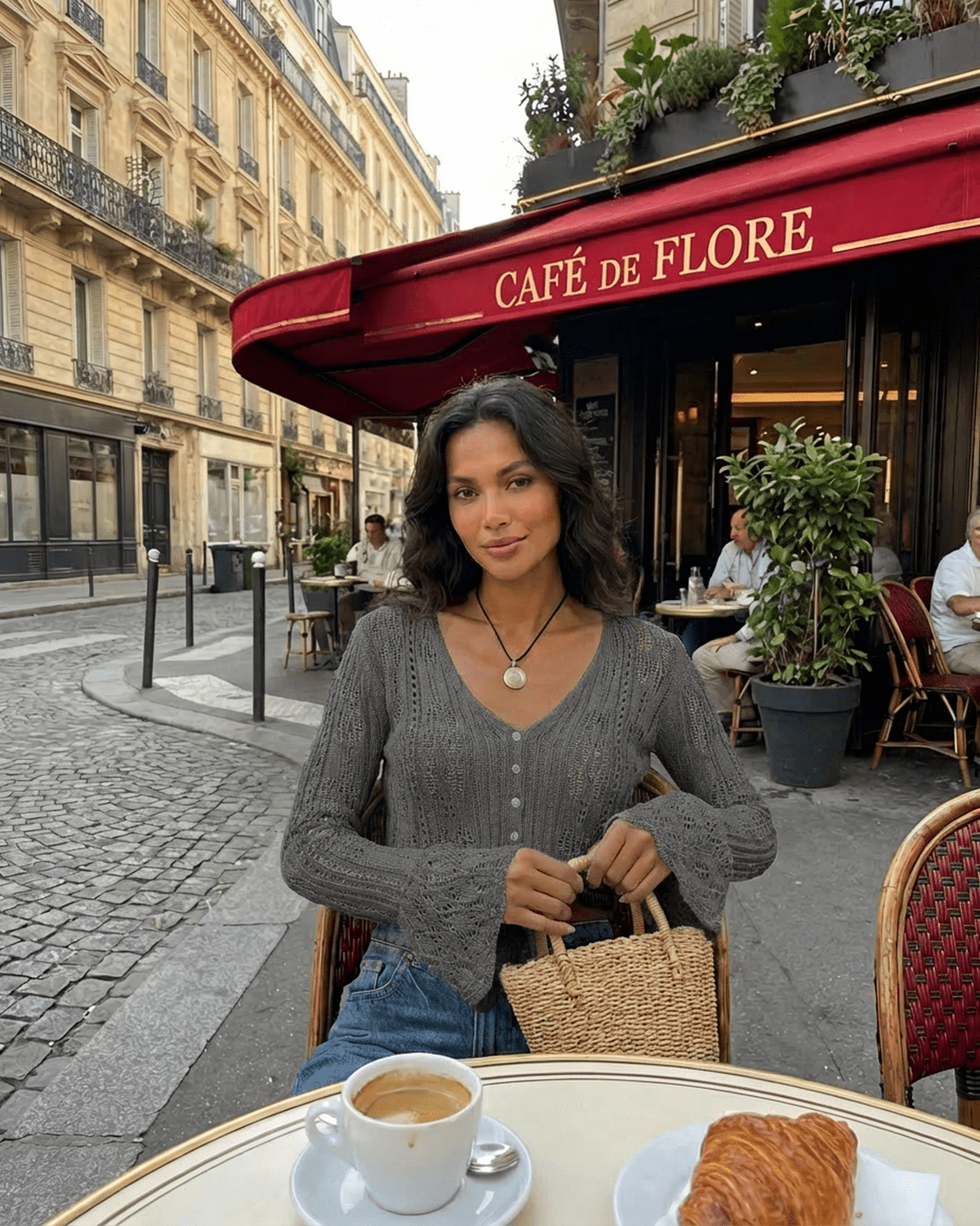 Slate Cardigan by Lauven worn at Café de Flore, showcasing a stylish cropped cotton knit with flare sleeves.
