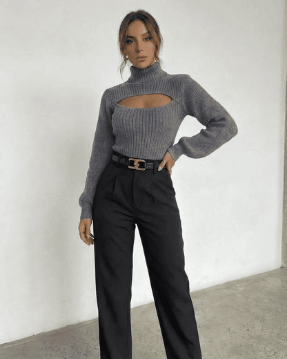 Slate Sweater from Lauven, featuring a mock neck and cut out design, showcased with tailored black pants.