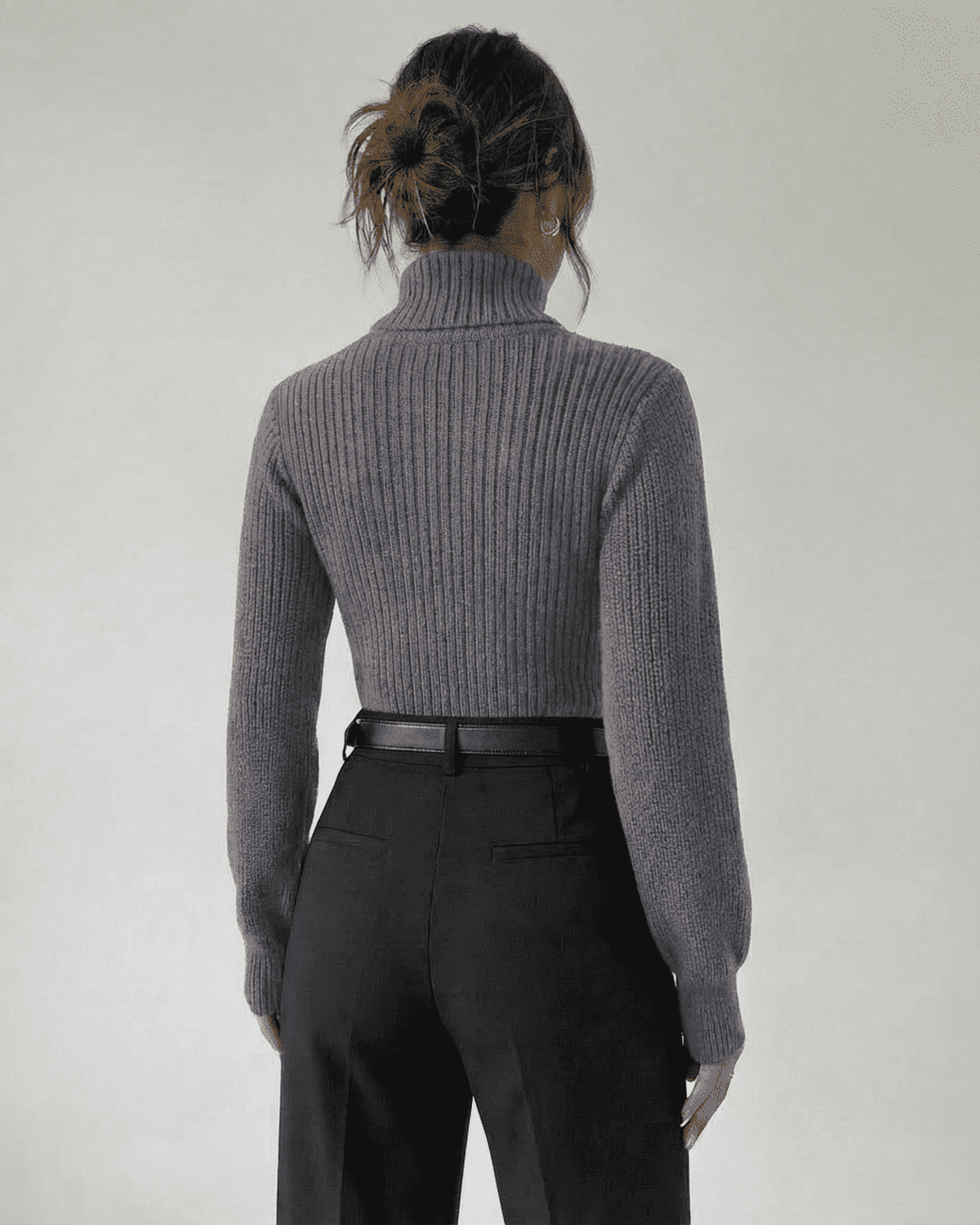Back view of the Slate Sweater by Lauven, featuring a mock neck and ribbed knit design.
