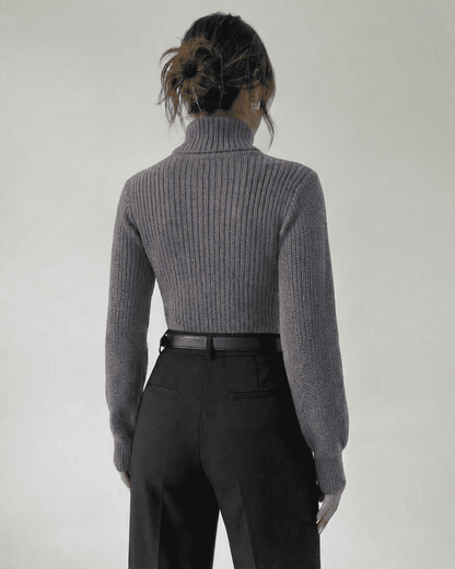 Back view of the Slate Sweater by Lauven, featuring a mock neck and ribbed knit design.